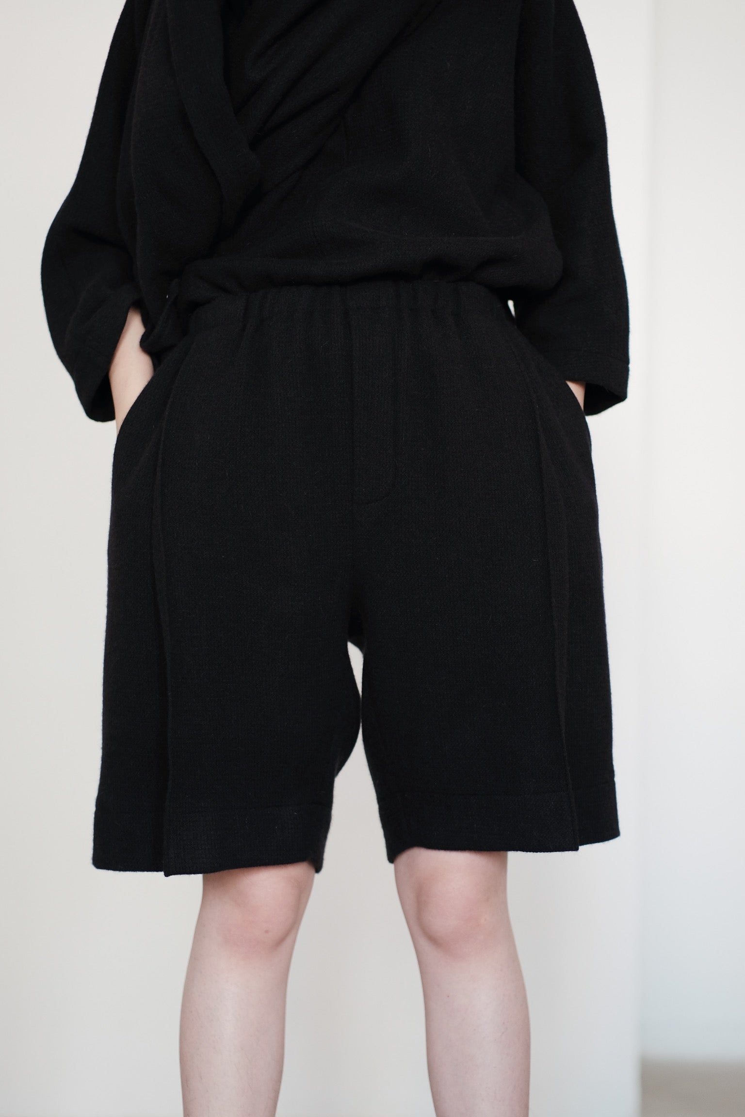 ARIA PLEAT-DETAIL SHORTS IN WOOL (BLACK) PRE-ORDER