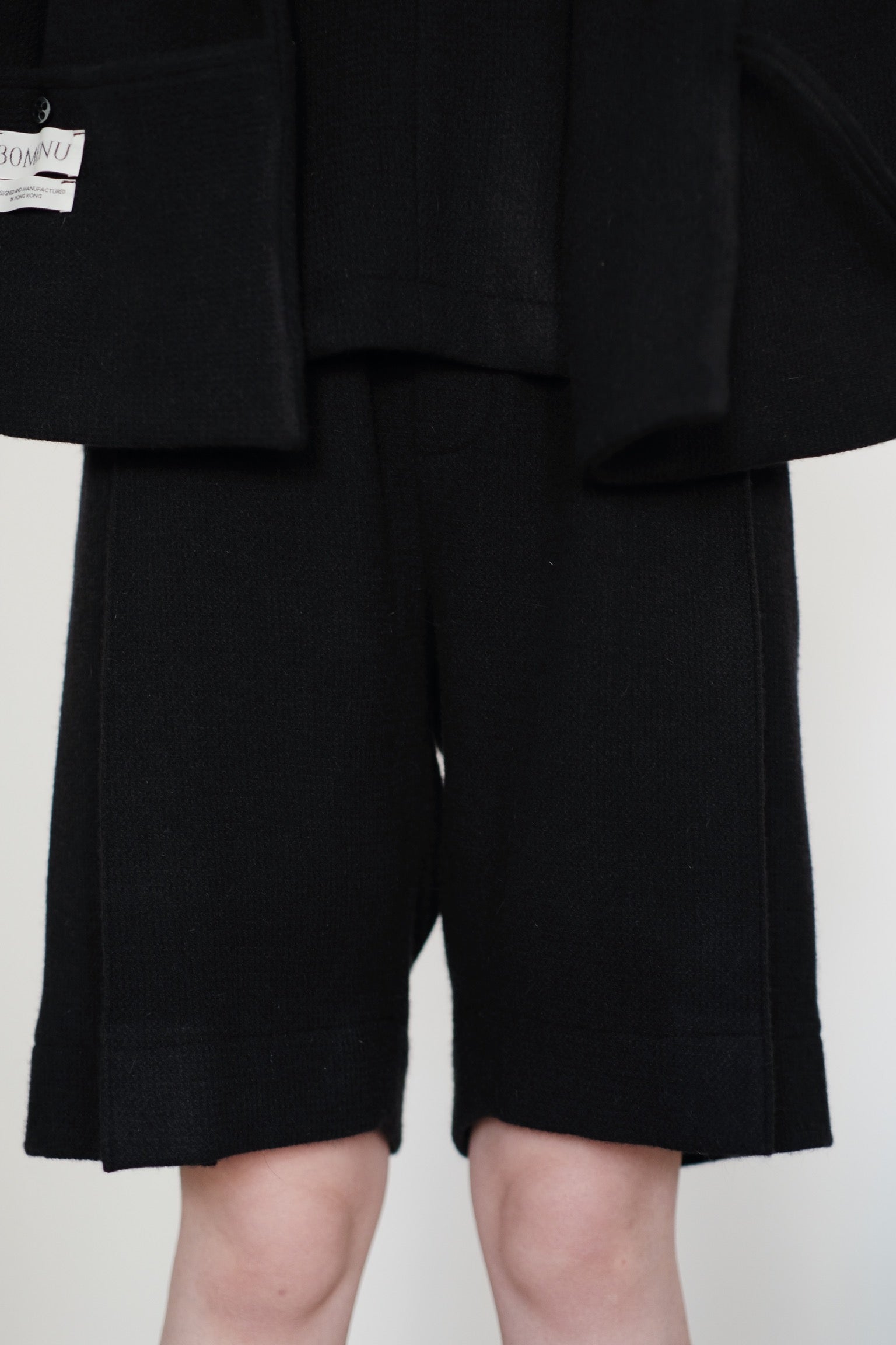 ARIA PLEAT-DETAIL SHORTS IN WOOL (BLACK) PRE-ORDER